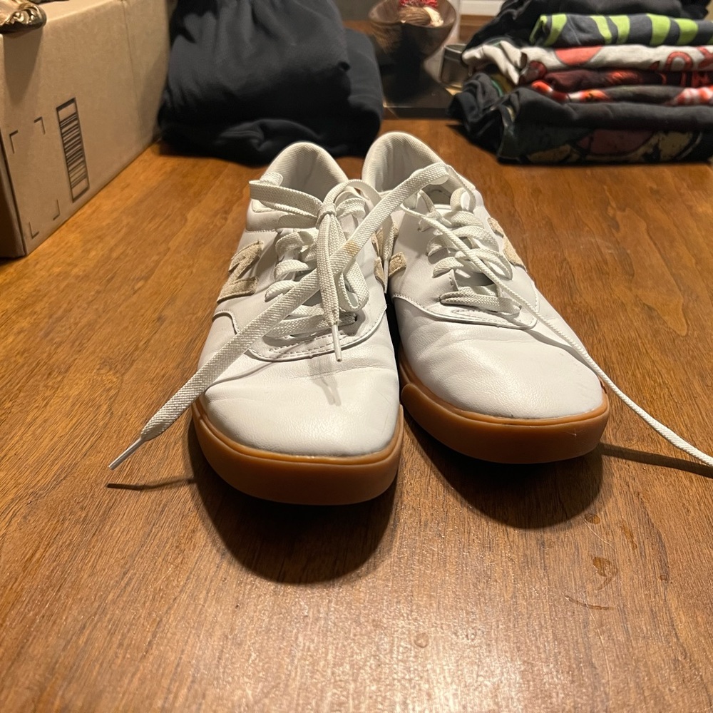 slightly worn Newbalance sneaks